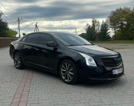 Черный Кадиллак ХТС, объемом двигателя 3.6 л и пробегом 215 тыс. км за 17000 $, фото 1 на Automoto.ua
