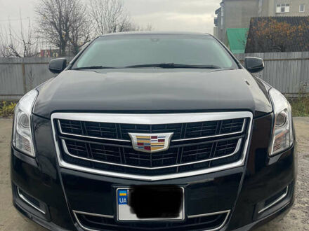 Черный Кадиллак ХТС, объемом двигателя 3.56 л и пробегом 275 тыс. км за 15600 $, фото 1 на Automoto.ua