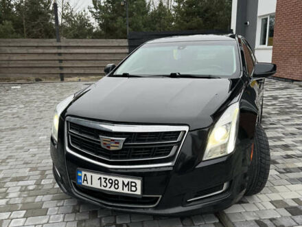 Черный Кадиллак ХТС, объемом двигателя 3.56 л и пробегом 330 тыс. км за 16000 $, фото 1 на Automoto.ua