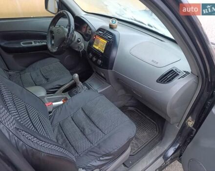 Чорний Чері Тігго, об'ємом двигуна 2 л та пробігом 231 тис. км за 2100 $, фото 26 на Automoto.ua