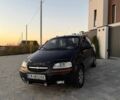 Черный Шевроле Авео, объемом двигателя 1.5 л и пробегом 200 тыс. км за 2500 $, фото 1 на Automoto.ua
