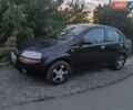 Черный Шевроле Авео, объемом двигателя 1.4 л и пробегом 200 тыс. км за 2200 $, фото 1 на Automoto.ua