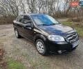 Черный Шевроле Авео, объемом двигателя 1.5 л и пробегом 256 тыс. км за 4200 $, фото 1 на Automoto.ua