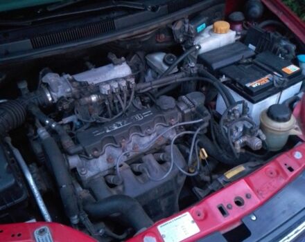 Красный Шевроле Авео, объемом двигателя 1.5 л и пробегом 130 тыс. км за 2500 $, фото 2 на Automoto.ua