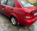 Красный Шевроле Авео, объемом двигателя 1.6 л и пробегом 230 тыс. км за 2300 $, фото 1 на Automoto.ua