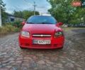 Красный Шевроле Авео, объемом двигателя 1.5 л и пробегом 238 тыс. км за 3200 $, фото 1 на Automoto.ua
