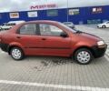 Красный Шевроле Авео, объемом двигателя 1.5 л и пробегом 260 тыс. км за 2350 $, фото 2 на Automoto.ua