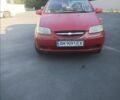 Красный Шевроле Авео, объемом двигателя 2 л и пробегом 200 тыс. км за 1800 $, фото 1 на Automoto.ua