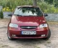 Красный Шевроле Авео, объемом двигателя 1.5 л и пробегом 250 тыс. км за 2450 $, фото 1 на Automoto.ua