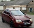 Красный Шевроле Авео, объемом двигателя 1.5 л и пробегом 220 тыс. км за 1350 $, фото 1 на Automoto.ua