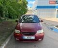 Красный Шевроле Авео, объемом двигателя 1.5 л и пробегом 200 тыс. км за 1050 $, фото 1 на Automoto.ua