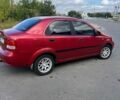 Красный Шевроле Авео, объемом двигателя 1.5 л и пробегом 243 тыс. км за 3200 $, фото 1 на Automoto.ua
