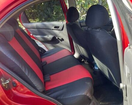 Красный Шевроле Авео, объемом двигателя 1.5 л и пробегом 210 тыс. км за 3400 $, фото 1 на Automoto.ua