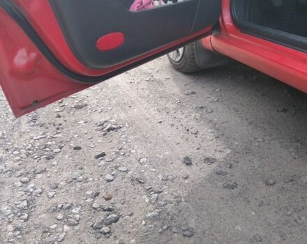 Красный Шевроле Авео, объемом двигателя 1.5 л и пробегом 325 тыс. км за 2900 $, фото 3 на Automoto.ua