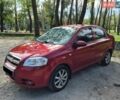 Красный Шевроле Авео, объемом двигателя 1.5 л и пробегом 252 тыс. км за 3900 $, фото 1 на Automoto.ua