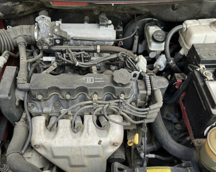 Красный Шевроле Авео, объемом двигателя 1.5 л и пробегом 230 тыс. км за 3750 $, фото 9 на Automoto.ua