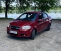 Красный Шевроле Авео, объемом двигателя 1.5 л и пробегом 245 тыс. км за 3400 $, фото 1 на Automoto.ua