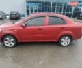 Красный Шевроле Авео, объемом двигателя 1.5 л и пробегом 285 тыс. км за 3800 $, фото 1 на Automoto.ua