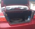 Красный Шевроле Авео, объемом двигателя 1.5 л и пробегом 258 тыс. км за 3300 $, фото 2 на Automoto.ua