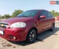 Красный Шевроле Авео, объемом двигателя 1.6 л и пробегом 261 тыс. км за 3600 $, фото 1 на Automoto.ua