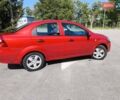 Красный Шевроле Авео, объемом двигателя 1.5 л и пробегом 173 тыс. км за 4500 $, фото 2 на Automoto.ua