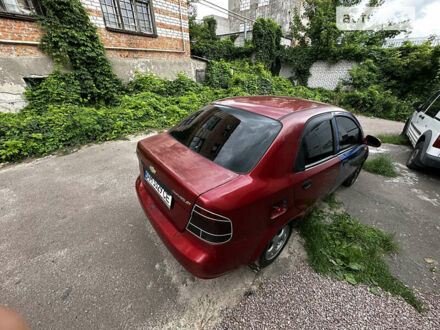 Красный Шевроле Авео, объемом двигателя 1.4 л и пробегом 150 тыс. км за 2200 $, фото 1 на Automoto.ua