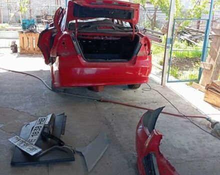 Красный Шевроле Авео, объемом двигателя 1.5 л и пробегом 320 тыс. км за 1200 $, фото 1 на Automoto.ua