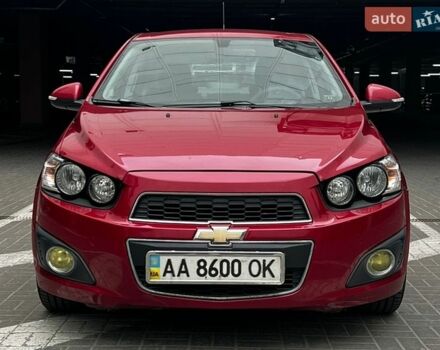 Красный Шевроле Авео, объемом двигателя 1.4 л и пробегом 98 тыс. км за 7500 $, фото 1 на Automoto.ua