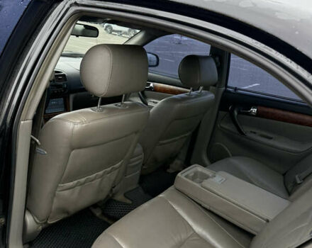 Чорний Шевроле Еванда, об'ємом двигуна 2 л та пробігом 299 тис. км за 3500 $, фото 7 на Automoto.ua