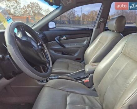 Чорний Шевроле Еванда, об'ємом двигуна 2 л та пробігом 280 тис. км за 3899 $, фото 2 на Automoto.ua