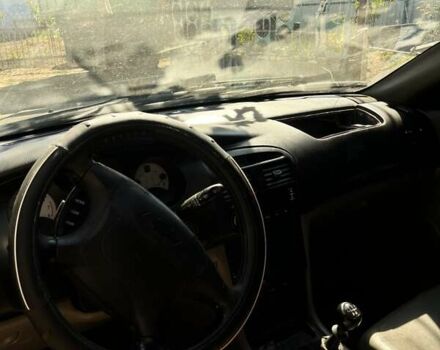 Чорний Шевроле Еванда, об'ємом двигуна 2 л та пробігом 150 тис. км за 3800 $, фото 6 на Automoto.ua