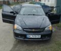 Чорний Шевроле Еванда, об'ємом двигуна 2 л та пробігом 270 тис. км за 3000 $, фото 1 на Automoto.ua