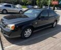Чорний Шевроле Еванда, об'ємом двигуна 2 л та пробігом 243 тис. км за 3299 $, фото 1 на Automoto.ua