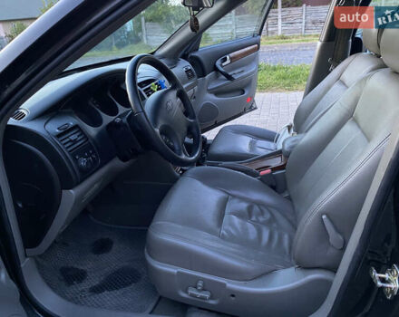 Черный Шевроле Эванда, объемом двигателя 2 л и пробегом 256 тыс. км за 4199 $, фото 8 на Automoto.ua