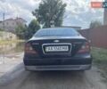 Черный Шевроле Эванда, объемом двигателя 2 л и пробегом 400 тыс. км за 3600 $, фото 2 на Automoto.ua