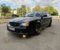 Чорний Шевроле Еванда, об'ємом двигуна 2 л та пробігом 216 тис. км за 3500 $, фото 1 на Automoto.ua