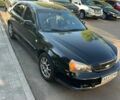 Чорний Шевроле Еванда, об'ємом двигуна 2 л та пробігом 283 тис. км за 3500 $, фото 1 на Automoto.ua