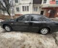 Чорний Шевроле Еванда, об'ємом двигуна 2 л та пробігом 200 тис. км за 3500 $, фото 1 на Automoto.ua