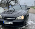 Чорний Шевроле Еванда, об'ємом двигуна 2 л та пробігом 100 тис. км за 2700 $, фото 1 на Automoto.ua