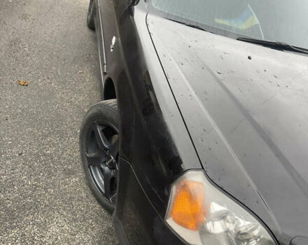 Чорний Шевроле Еванда, об'ємом двигуна 2 л та пробігом 292 тис. км за 3000 $, фото 8 на Automoto.ua