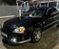 Черный Шевроле Эванда, объемом двигателя 2 л и пробегом 3 тыс. км за 5200 $, фото 1 на Automoto.ua