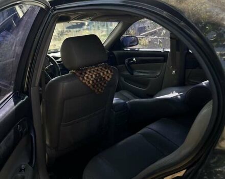 Чорний Шевроле Еванда, об'ємом двигуна 2 л та пробігом 150 тис. км за 3800 $, фото 7 на Automoto.ua