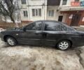 Черный Шевроле Эванда, объемом двигателя 2 л и пробегом 200 тыс. км за 3500 $, фото 1 на Automoto.ua