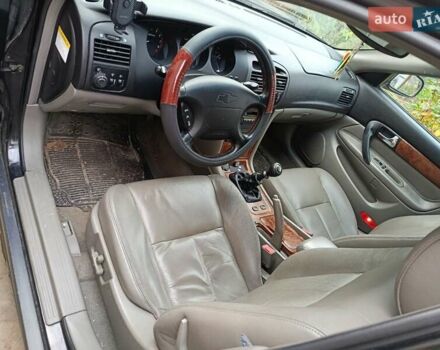 Черный Шевроле Эванда, объемом двигателя 2 л и пробегом 207 тыс. км за 4436 $, фото 4 на Automoto.ua