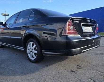 Чорний Шевроле Еванда, об'ємом двигуна 2 л та пробігом 290 тис. км за 2850 $, фото 7 на Automoto.ua