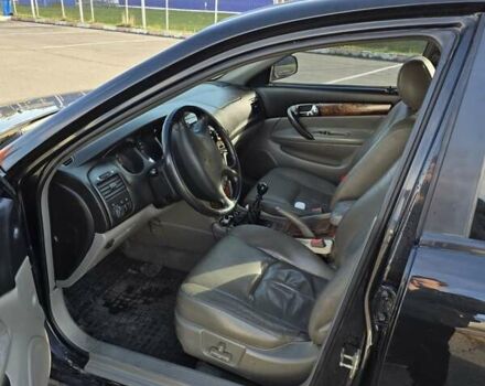 Чорний Шевроле Еванда, об'ємом двигуна 2 л та пробігом 290 тис. км за 2850 $, фото 10 на Automoto.ua