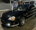 Чорний Шевроле Еванда, об'ємом двигуна 2 л та пробігом 260 тис. км за 5100 $, фото 1 на Automoto.ua