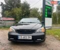 Черный Шевроле Эванда, объемом двигателя 2 л и пробегом 268 тыс. км за 3250 $, фото 6 на Automoto.ua