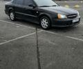 Черный Шевроле Эванда, объемом двигателя 2 л и пробегом 350 тыс. км за 3400 $, фото 1 на Automoto.ua