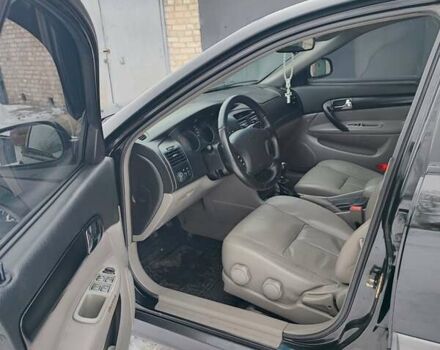 Черный Шевроле Эванда, объемом двигателя 2 л и пробегом 197 тыс. км за 5200 $, фото 39 на Automoto.ua